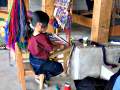 Child learning to weave